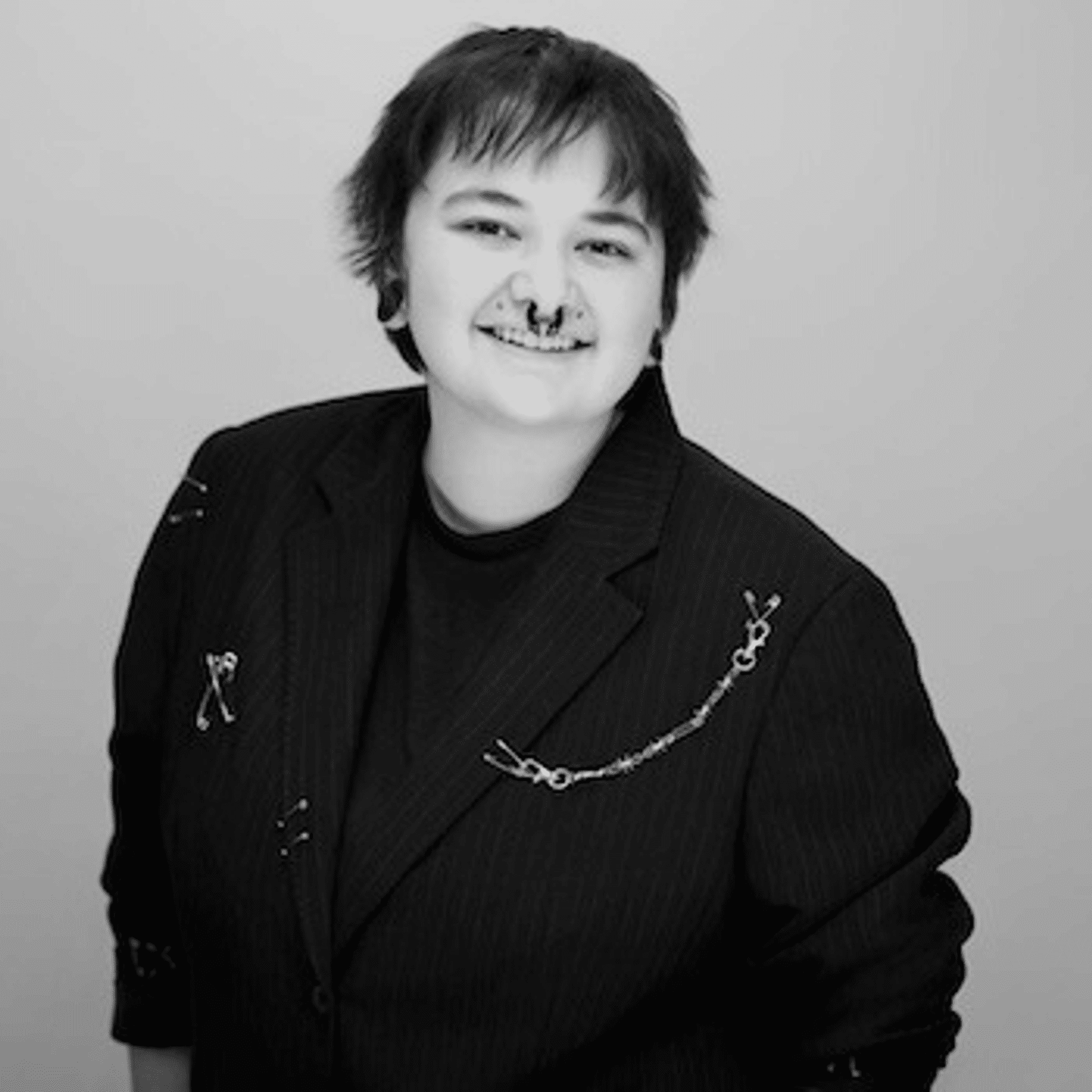 Portrait of Grayson, a professional stylist at PR At Partners, showcasing their expertise and style.