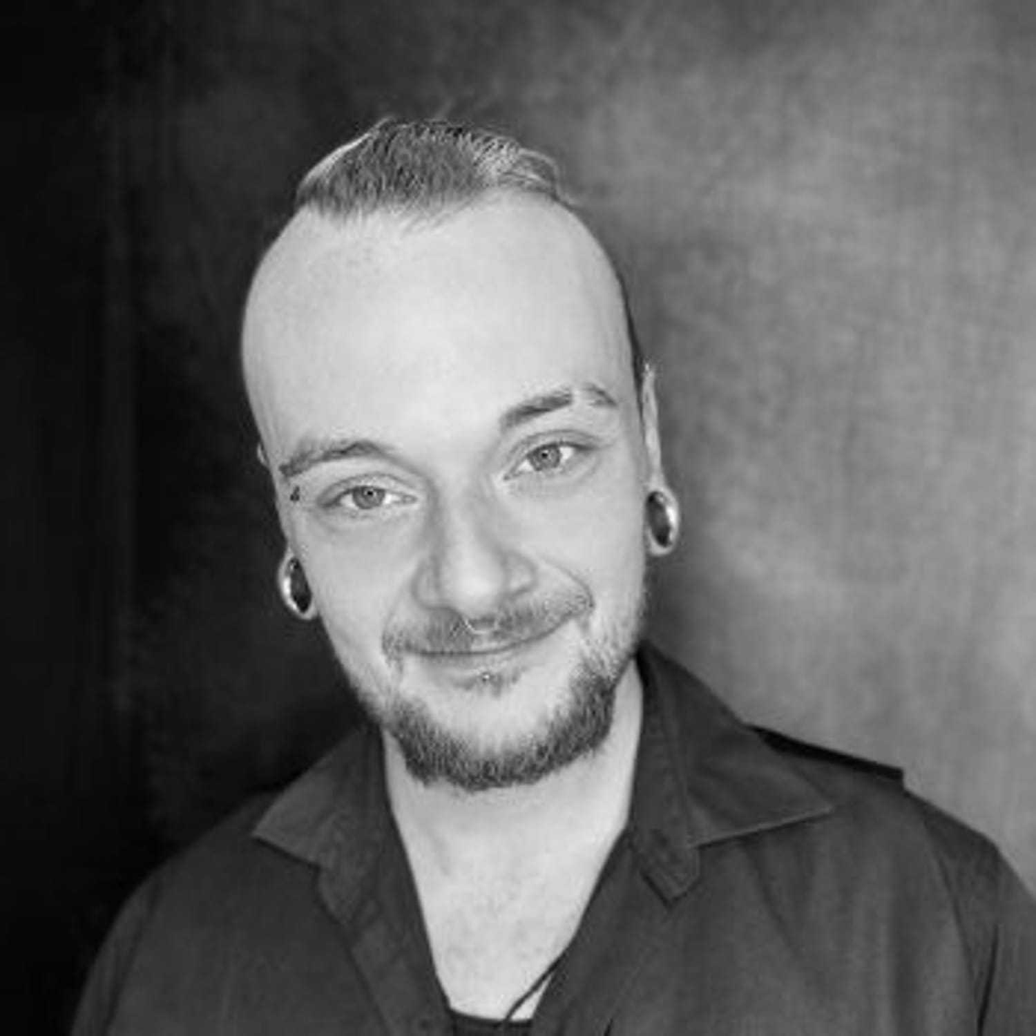 Portrait of Brandon Wells, a professional stylist at PR At Partners, showcasing their expertise and style.