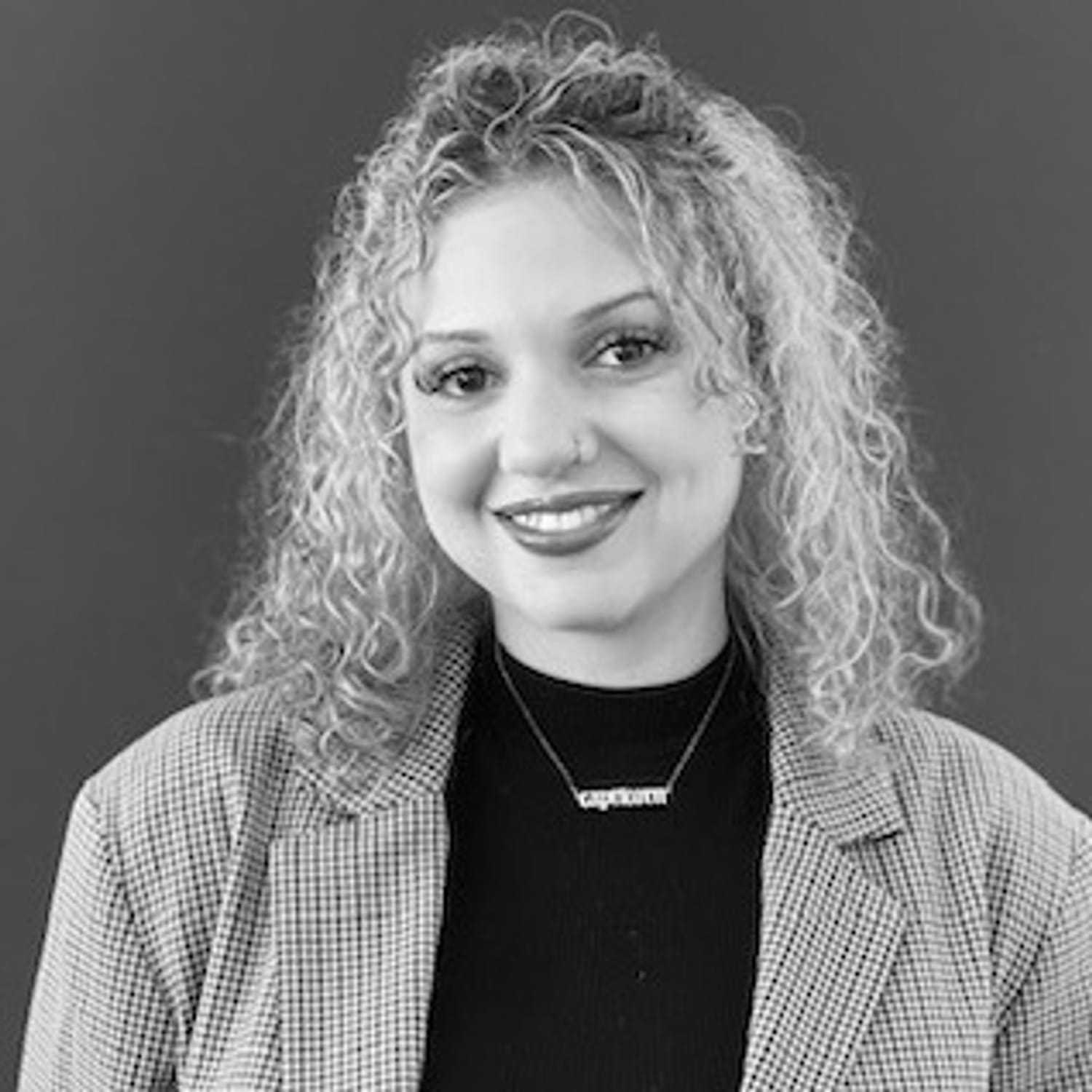 Portrait of Raeghan, a professional stylist at PR At Partners, showcasing their expertise and style.