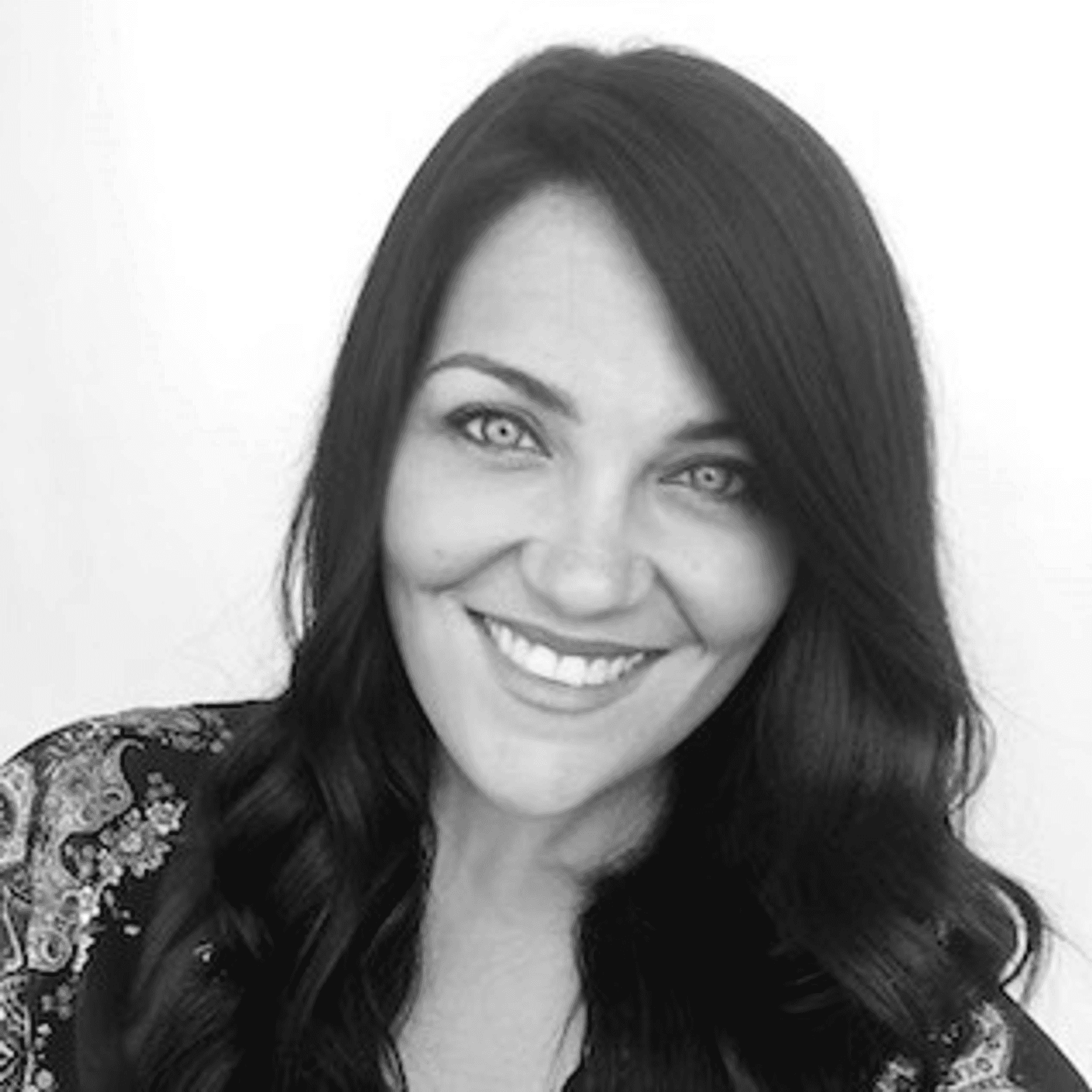 Portrait of Jenn McMillan, a professional stylist at PR At Partners, showcasing their expertise and style.